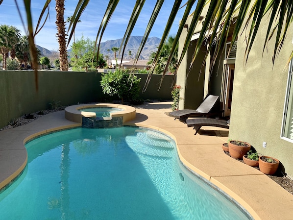A heated pool, pool loungers