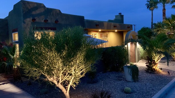 A building with a desert garden, including a tree and cacti. - Relaxing Desert Oasis-Salt Water Pool & Jacuzzi/Mountain Views/#067735 3bd (La Quinta)