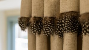A close-up of a curtain with a textured pattern and tassels. - Cotswolds Barn Apartment - luxury self catering near Bath & Bristo (Bristol)
