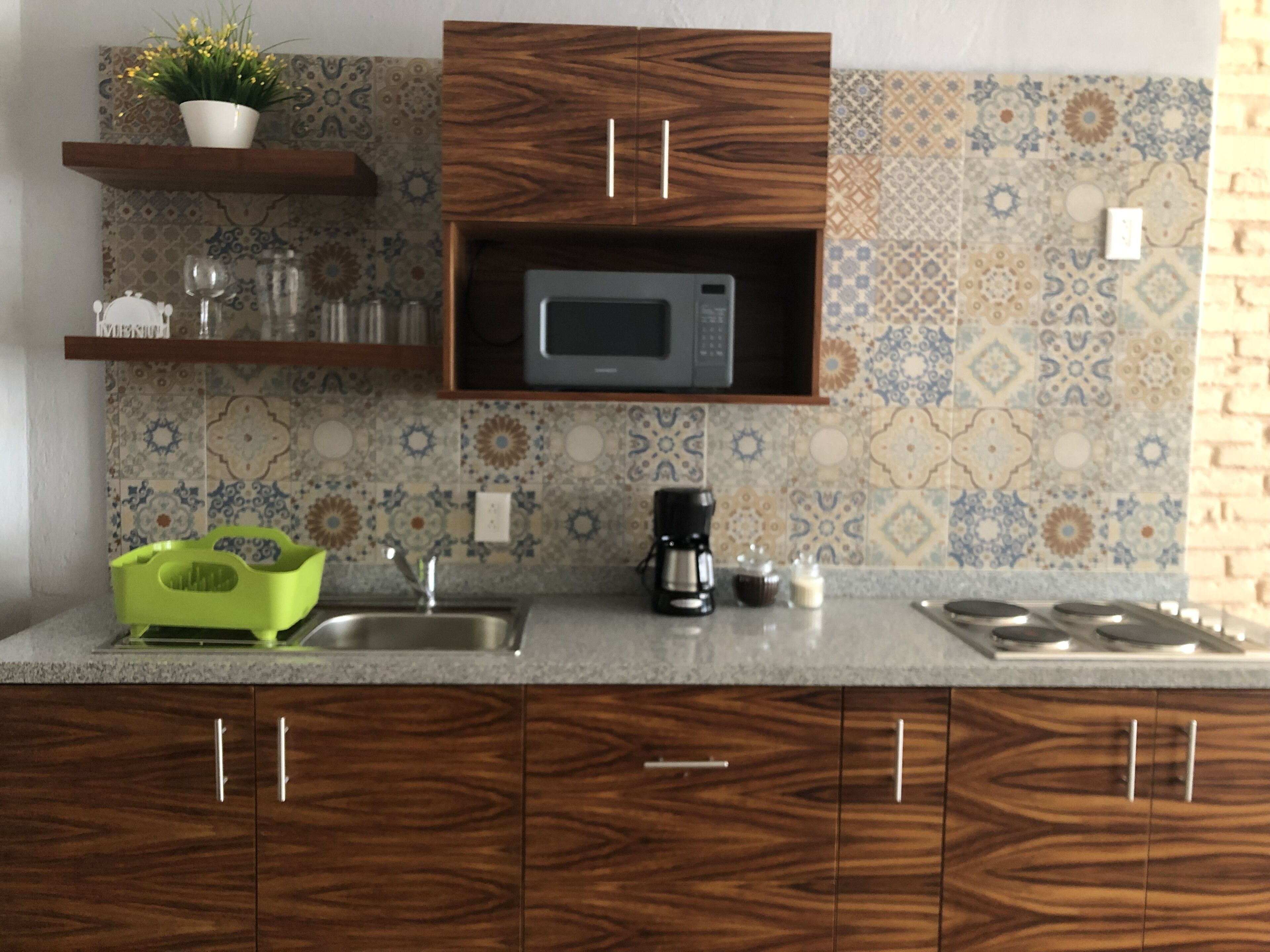 Fridge, microwave, stovetop, coffee/tea maker