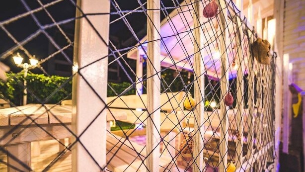 A chain-link fence with decorative elements, possibly for security or decoration. - Hotel Beatris (Nessebar)