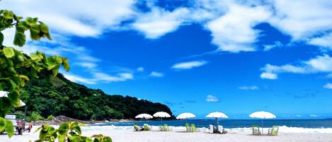 On the beach, sun loungers