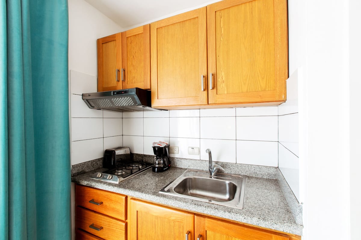 deluxe studio, multiple beds, garden view | private kitchen | fridge, microwave, stovetop, coffee/tea maker