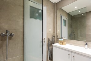 Shower, hair dryer, towels, soap