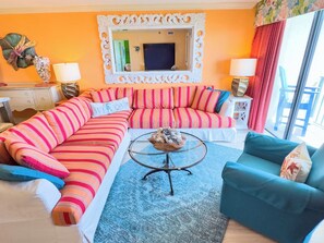 A living room with a sofa, a coffee table, and a chair. - Beach Club I 3E (North Myrtle Beach)