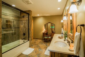 Combined shower/bathtub, hair dryer, towels, toilet paper