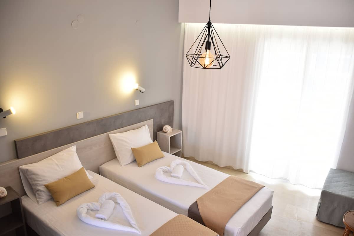 Classic Studio, Partial Sea View | In-room safe, blackout drapes, cribs/infant beds, free WiFi
