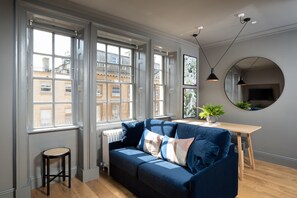 Standard Studio, 1 Queen Bed with Sofa bed, Kitchen, City View | Living area | 42-inch flat-screen TV with satellite channels, TV - Hiding Space - Trim Street Apartments (Bath)