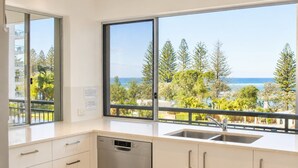 Fridge, microwave, oven, stovetop - Joanne Terrace 203 | Ocean Views & Kings Beach Escape (Caloundra)