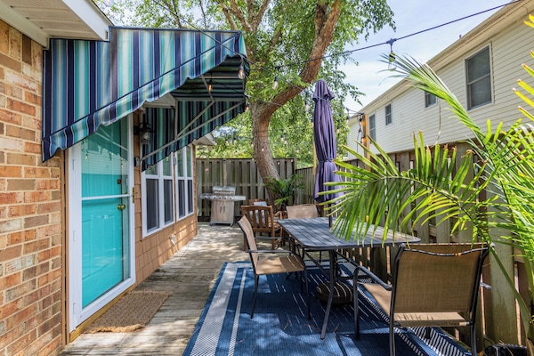 Unit A patio area with Tables, Garden Lights and Grill