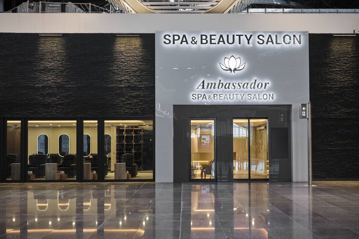 A SPA&BEAUTY SALON with a modern design, featuring a large glass entrance and a clean, reflective floor.