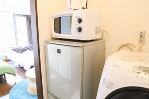 Appartement, 1 chambre | Cuisinette privée | Réfrigérateur, four à micro-ondes, surface de cuisson