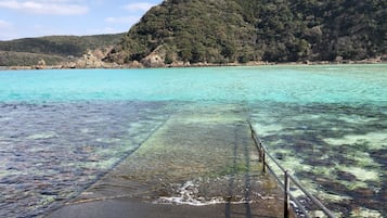Beach nearby, white sand, beach shuttle, beach umbrellas