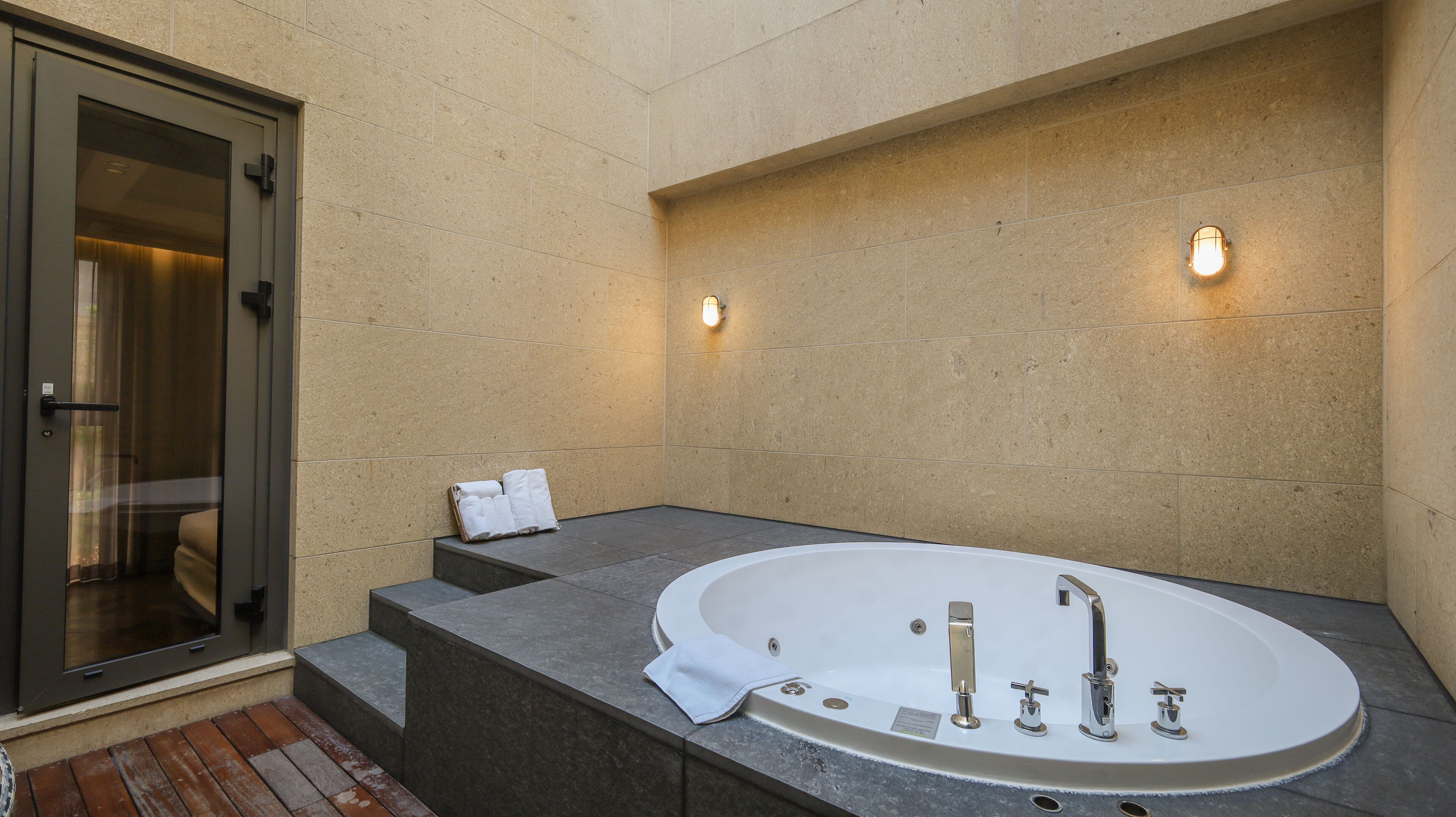 combined shower/bathtub, designer toiletries, hair dryer, bathrobes