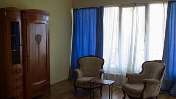Family Room, Multiple Beds | Living area | Flat-screen TV