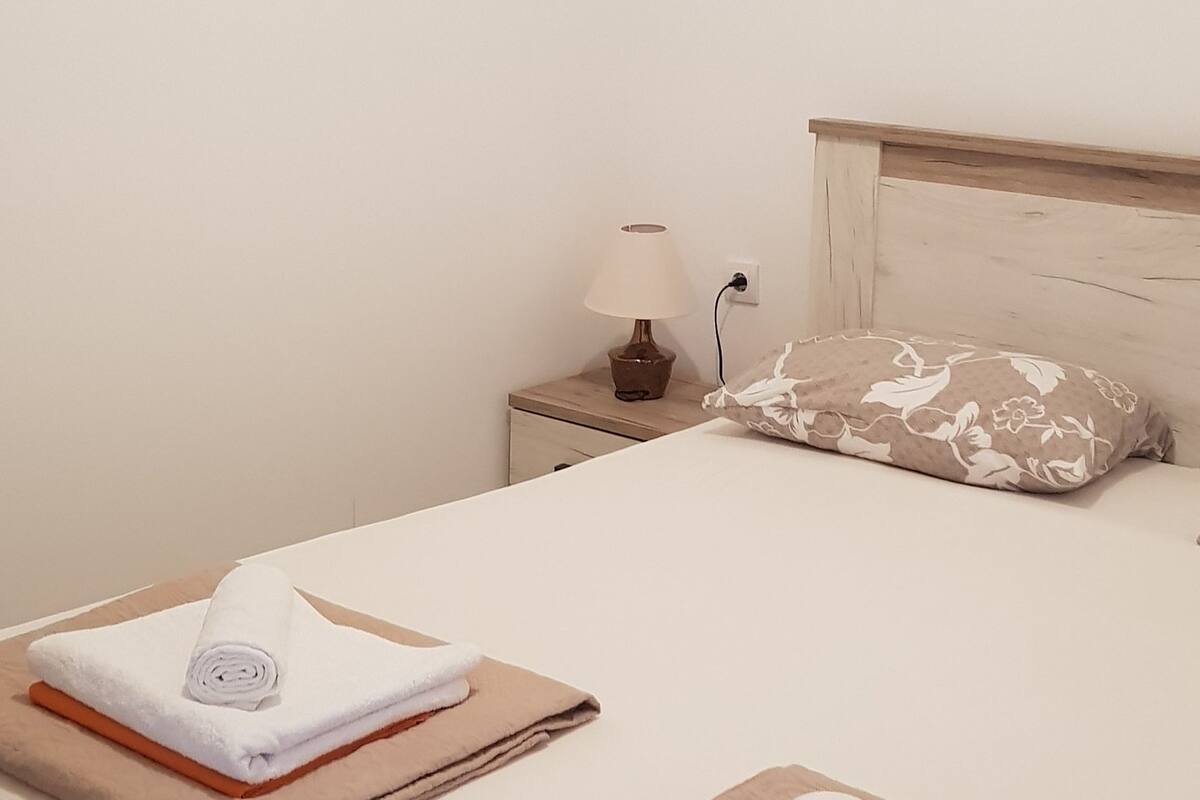 Apartment, 1 Bedroom, Ground Floor | Living room | Flat-screen TV