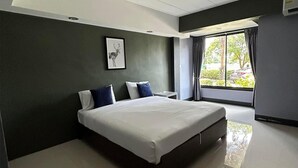 A modern bedroom with a large bed, a nightstand, a framed picture on the wall, and a window with curtains. - Nitta Ville (Hang Chat)