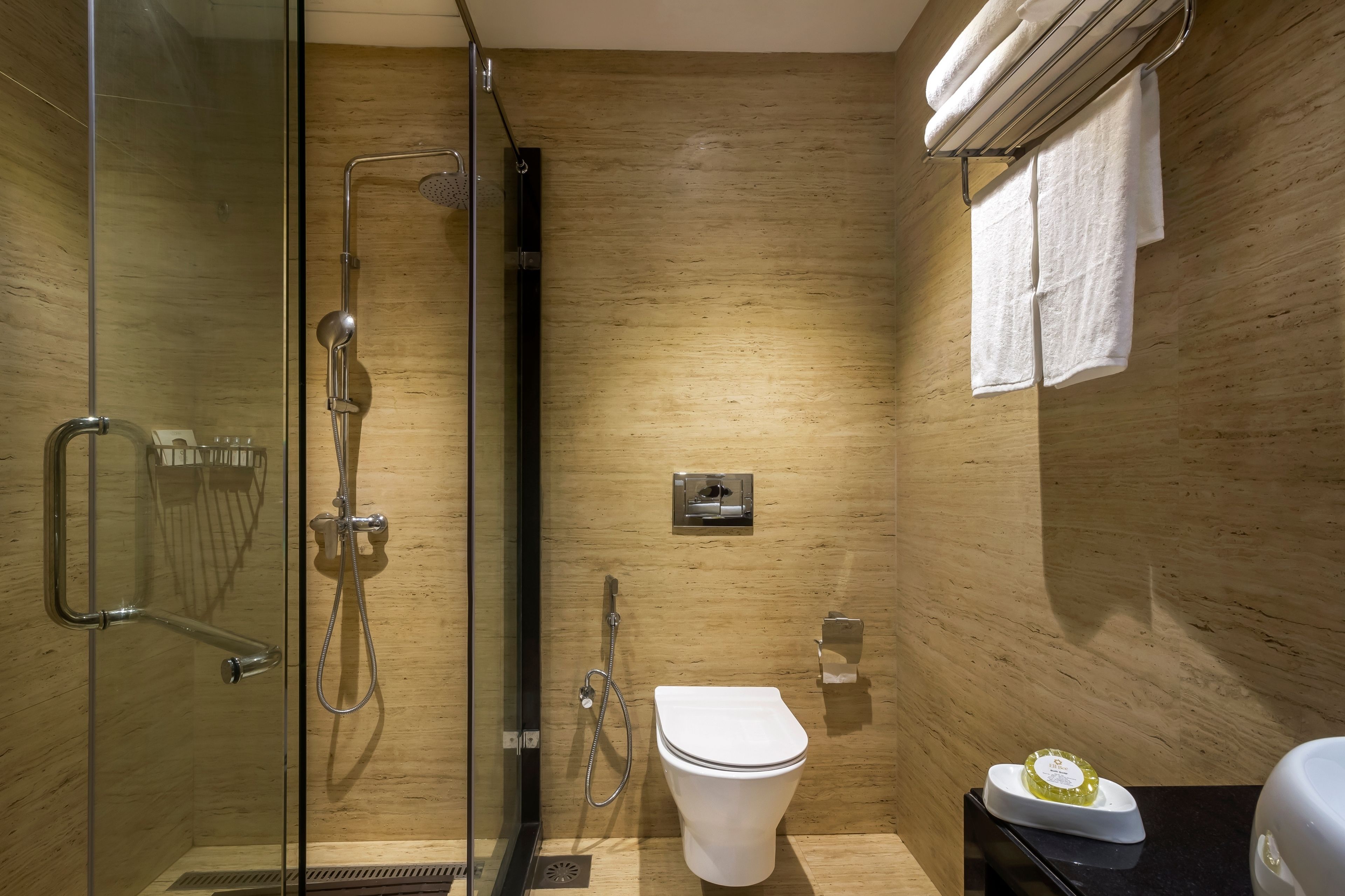deluxe room | bathroom | shower, rainfall showerhead, free toiletries, hair dryer