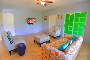 Premium Villa, Ocean and Pool View | Living room | 40-inch Smart TV with cable channels, TV