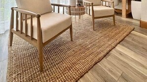A modern living room with two sofas, a round coffee table, and a floor lamp. There is a large window with sheer curtains, a potted plant, and a framed picture on the wall. - Largo Getaway • 3 King Suites + In-Laws Quarters, Pickleball (Key Largo)
