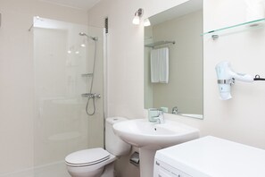Shower, hair dryer, towels, toilet paper