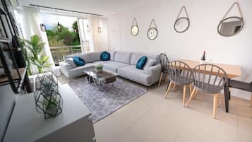 Grand Apartment, 3 Bedrooms | Living area | Plasma TV