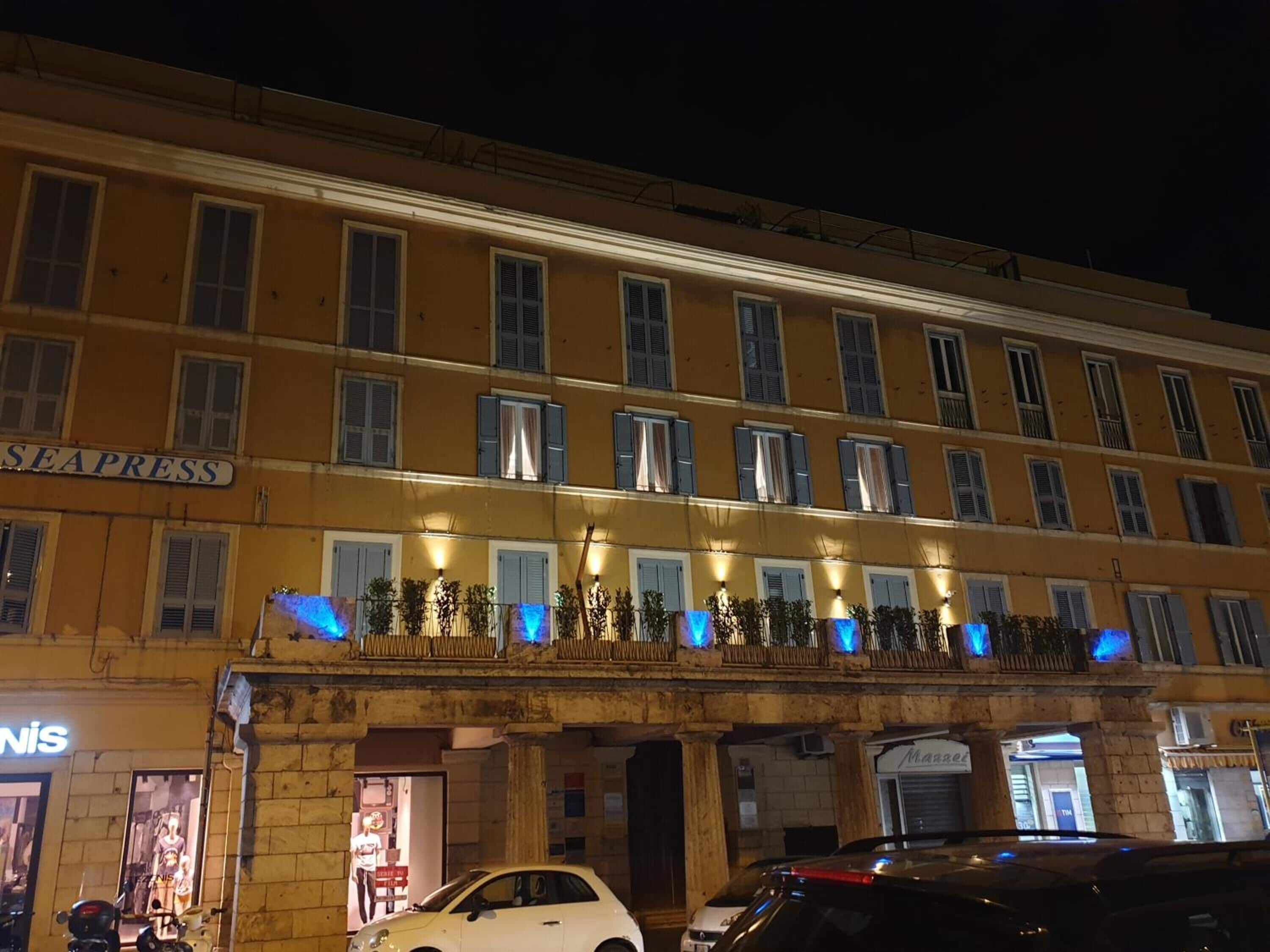 A multi-story building with a sign reading "SEAPRESS" on the upper floor.