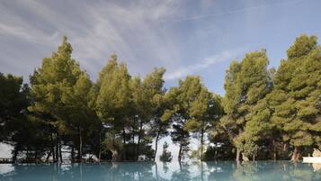 Seasonal outdoor pool, open 11:00 AM to 7:00 PM, sun loungers