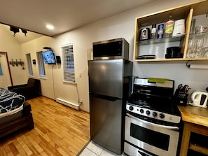 Enjoy cooking in this fully equipped kitchen with a refrigerator, oven, microwave, and stovetop.