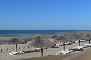 On the beach, sun loungers, beach towels