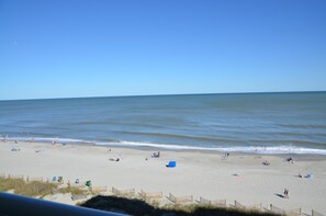 On the beach, sun-loungers