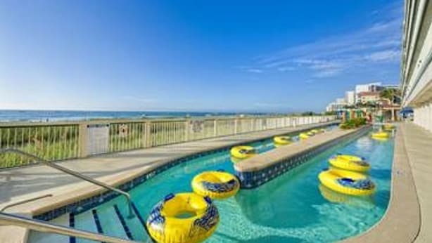 A swimming pool with multiple lanes and yellow floating rings. - July 4th Week - Ocean Front 1 Bedroom Deluxe Westgate Myrtle Beach Resort (Myrtle Beach)