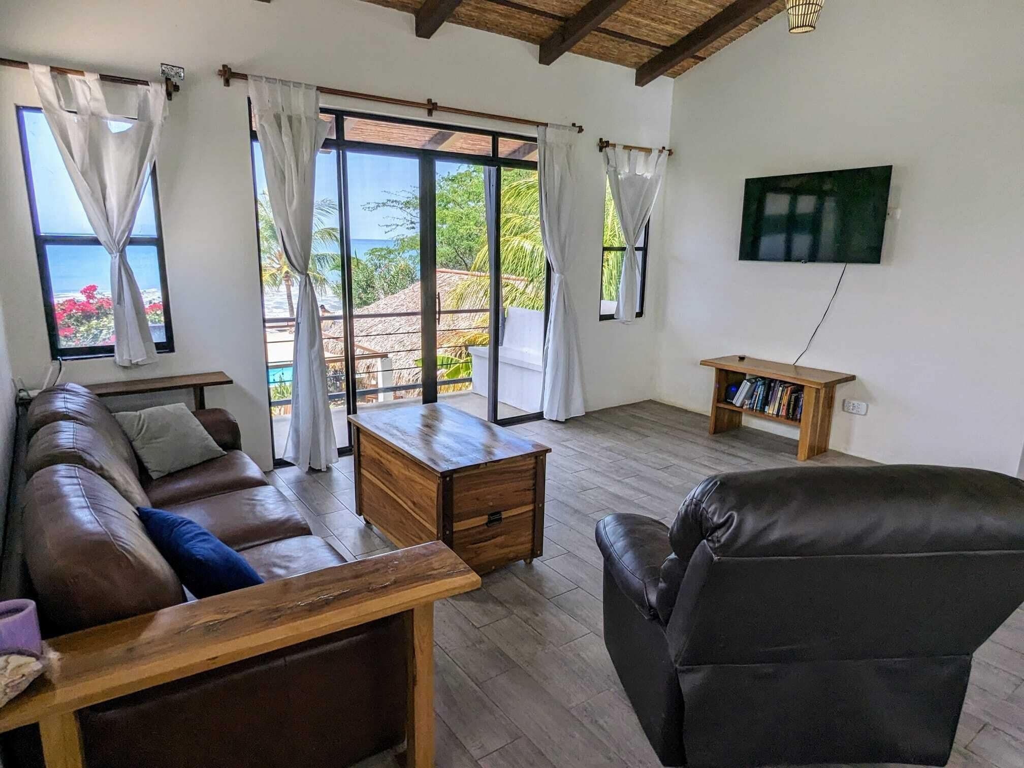 premium studio suite, 1 king bed, kitchen, ocean view | living area