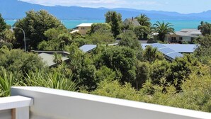 A residential area with houses surrounded by lush greenery and a view of the ocean. - Jewel in Tata Beach. (Tata Beach)