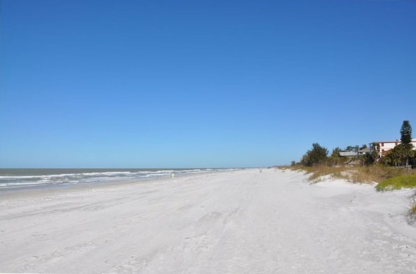 On the beach, sun loungers, beach towels
