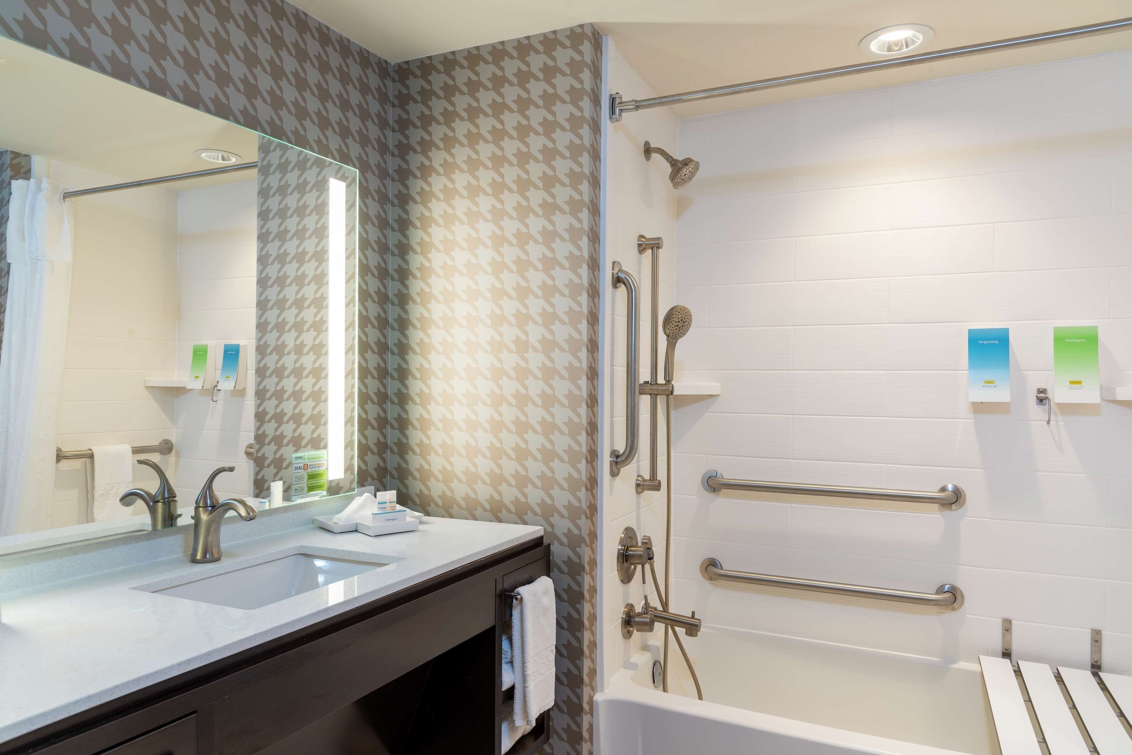 designer toiletries, hair dryer, towels, soap