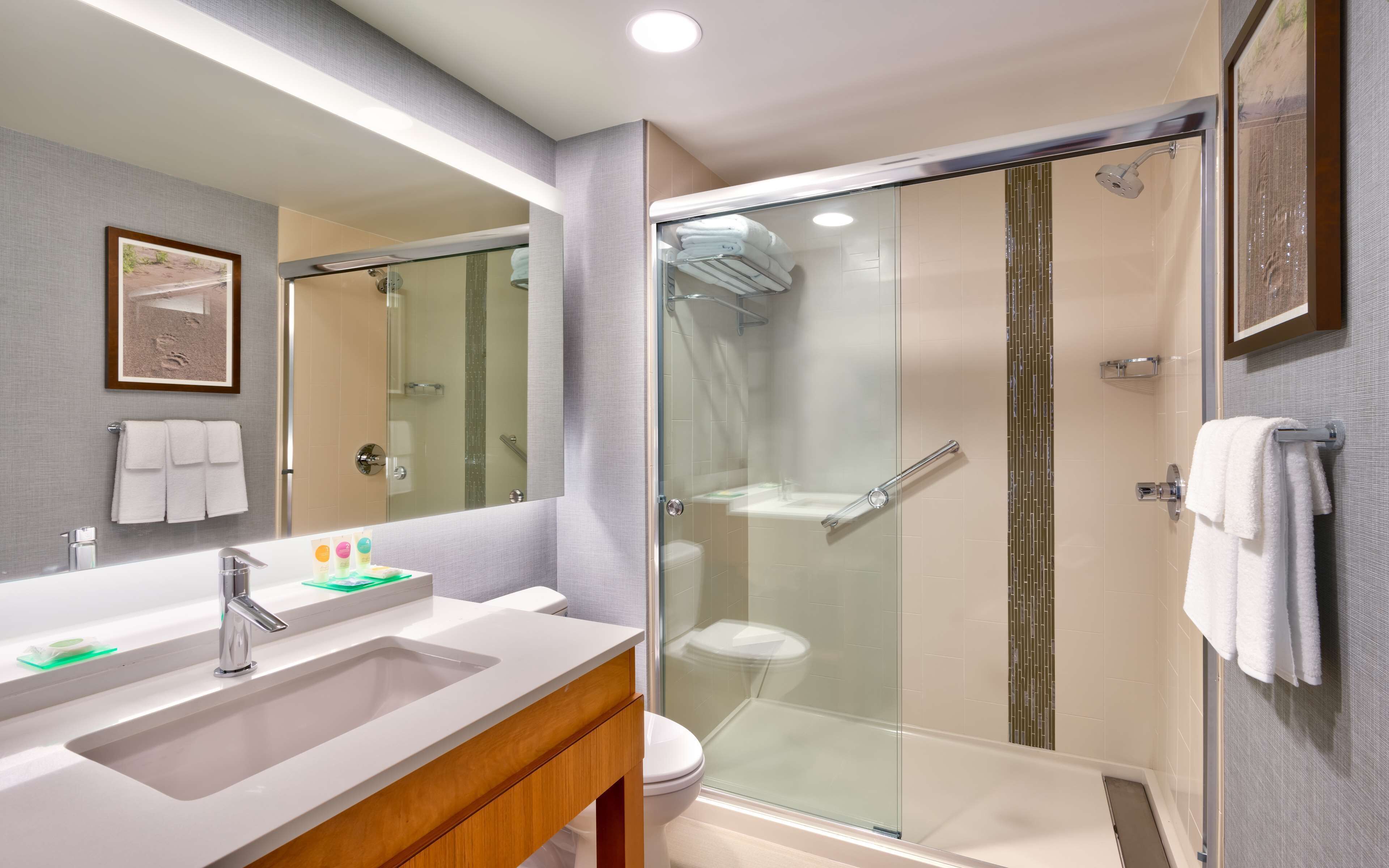 designer toiletries, hair dryer, towels