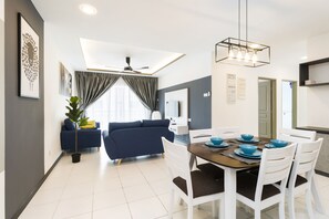 Deluxe Apartment | Living area | 28-inch flat-screen TV with cable channels, TV