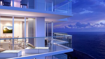 Enjoy unobstructed ocean views from the balcony, where you can relax in a comfortable seating area. at Amrit Ocean Resort and Residences - Singer Island