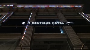 The exterior of the Boutique Hotel with a prominent sign and decorative lighting. - H Boutique Hotel Xplorer Loke Yew (Kuala Lumpur)