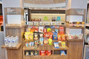 A snack display with various brands and types of snacks.
