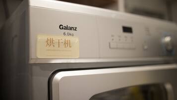 A front view of a washing machine with a label indicating it is a 6.0kg model from the brand Galanz.