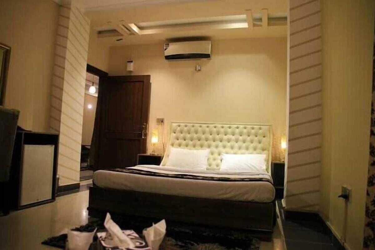 Appartement, plusieurs lits | Coffres-forts dans les chambres, fer et planche Ă repasser
