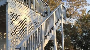 A staircase leading to a building with a sign indicating 'The Vineyard Loft Parking'. - Papillon Cellars (Mariposa)