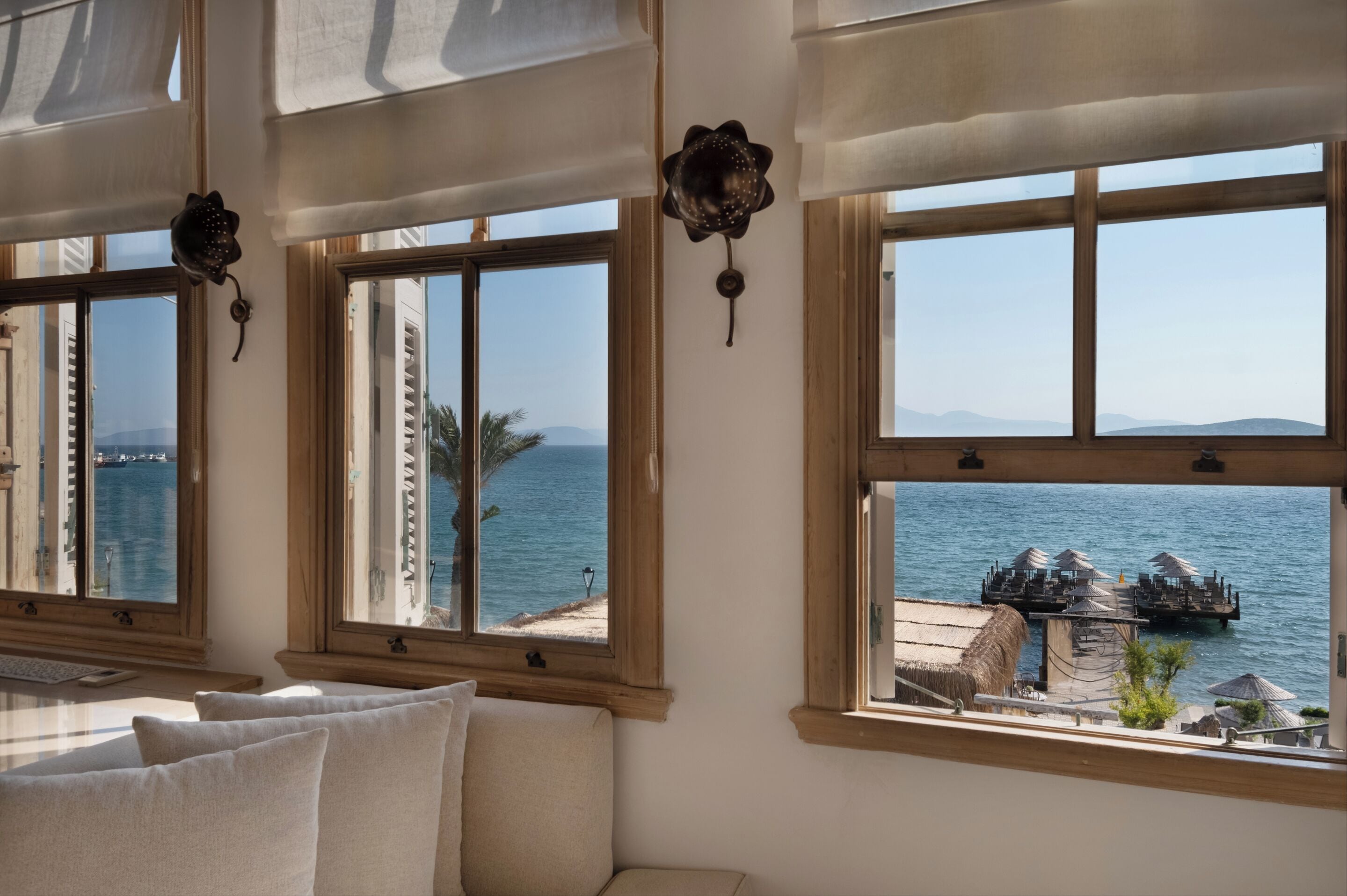 panoramic suite, 1 king bed, sea view, beachfront | 1 bedroom, in-room safe, individually decorated, individually furnished
