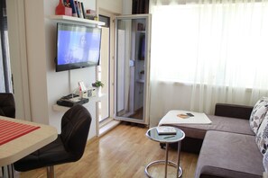 City Apartment, 1 Queen Bed with Sofa bed | Living room | Flat-screen TV