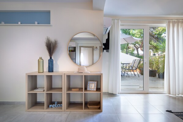 Two Bedroom Apartment With Garden | Living area | TV - Vouliagmeni Stylish Homes by BluPine (Vari-Voula-Vouliagmeni)