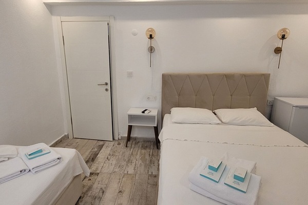 Bodrum Kat Triple Room | Minibar, iron/ironing board (on request), WiFi (free), bed sheets