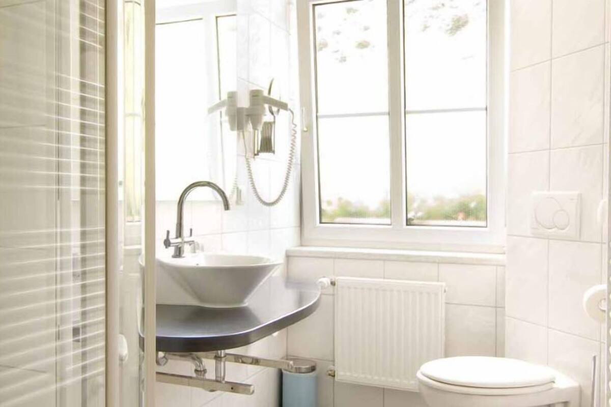 Shower, free toiletries, hair dryer, towels
