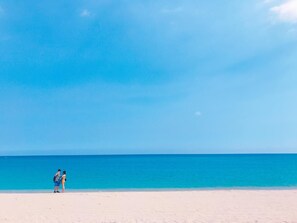 Beach nearby, white sand, beach umbrellas, 2 beach bars